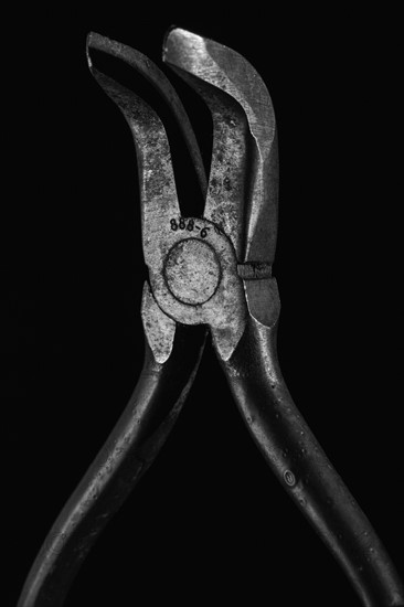Hand tool against black background