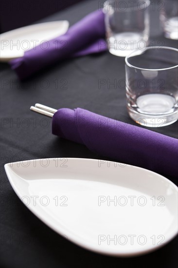 Plates, chopsticks and glasses