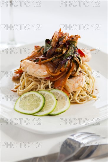 Shrimp and pasta on white plate