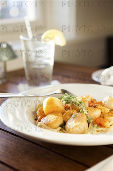 Scallops on white plate