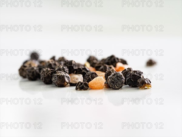 Pepper and himalayan salt against white background