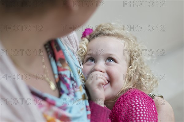 Mother holding daughter (4-5)