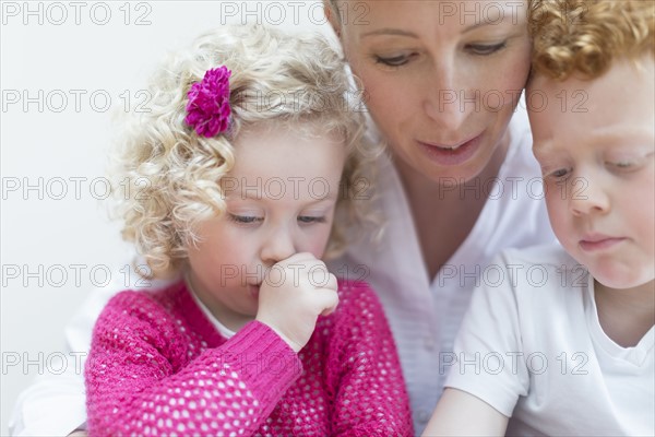 Portrait of mother with daughter (4-5) and son (8-9)