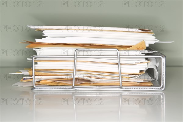 Stack of documents on tray.