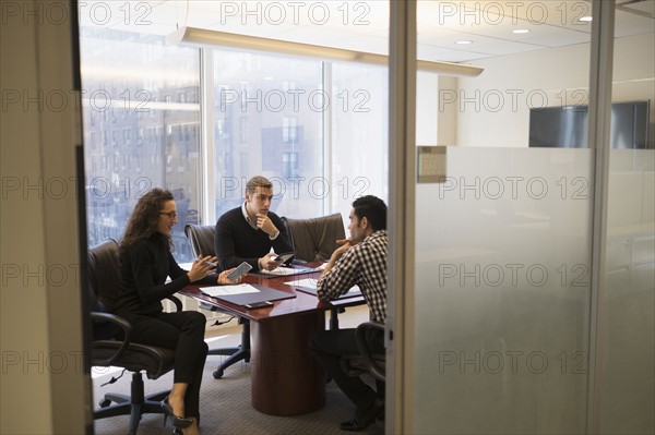 Young business people having meeting in conference room.