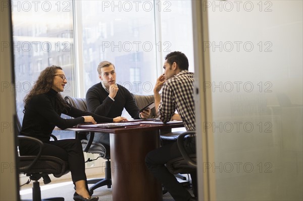 Young business people having meeting in conference room.