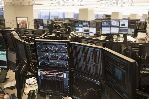 Trading floor with working computers.
