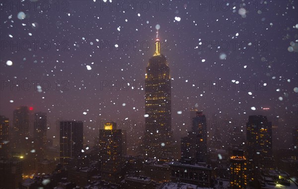 USA, New York State, New York City, Empire State Building and city skyline in snow.