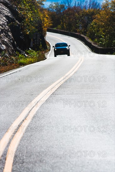 Lonely car on mountain road