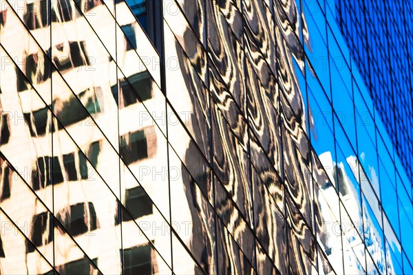 USA, New York, Distorted reflections in office building