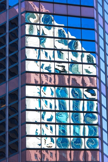 USA, New York, Distorted reflections in Glass building