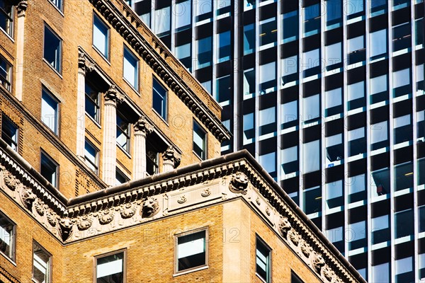 USA, New York, Old building and modern office block behind