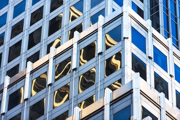 USA, New York, Distorted reflections in Glass building