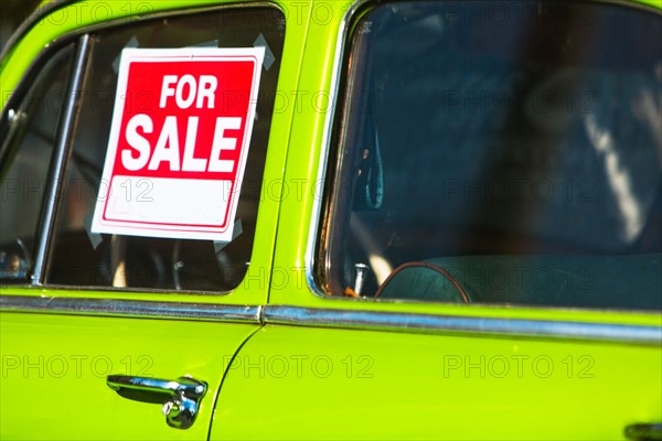 For sale sign on car window