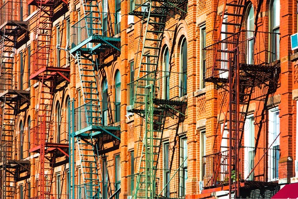 USA, New York, New York City, Fire escapes of apartments