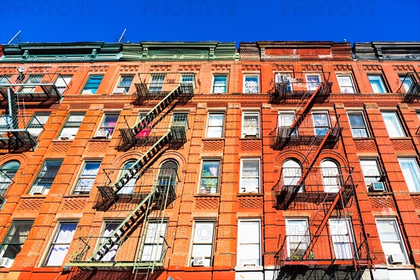 USA, New York, New York City, Fire escapes of apartments