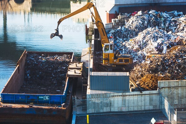 Excavator at garbage dump