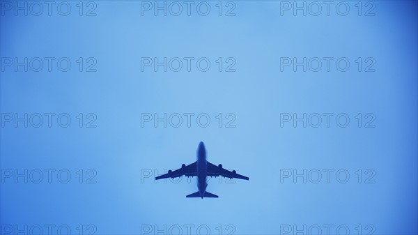Airplane flying against clear sky