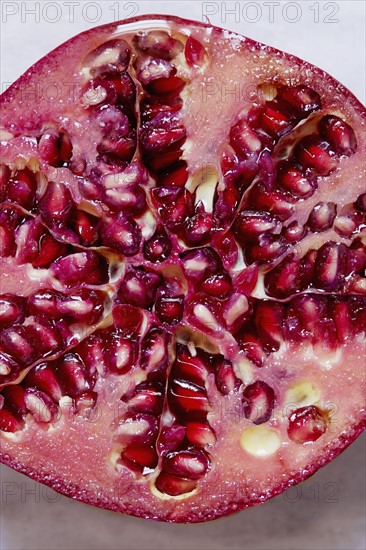 Halved Pomegranate against white background