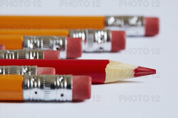 Pencils and crayon on white surface