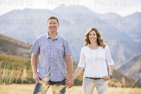 USA, Utah, Provo, Smiling couple holding hands