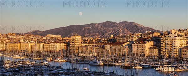 France, Provence-Alpes-Cote d'Azur, Marseille, Cityscape with Vieux port - Old Port, mountain in background