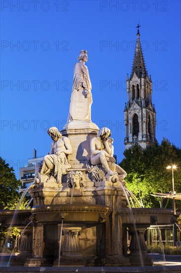 France, Occitanie, Nimes, Esplanade Charles De Gaulle with fountain at dusk