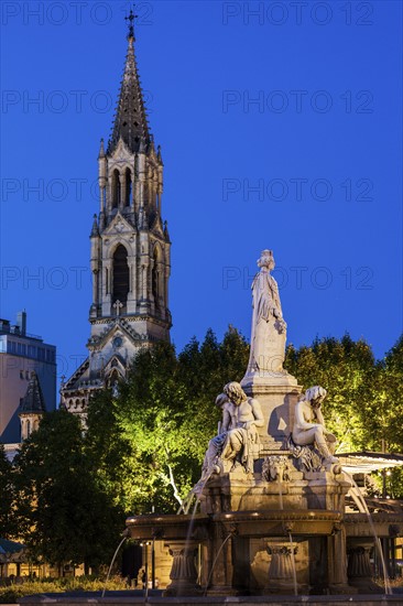 France, Occitanie, Nimes, Esplanade Charles De Gaulle with fountain at dusk