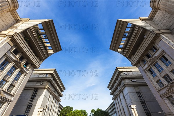 France, Occitanie, Montpellier, Low angle view of modern architecture of Quartier Antigone