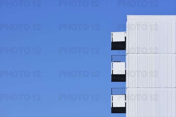 Apartment building against clear blue sky
