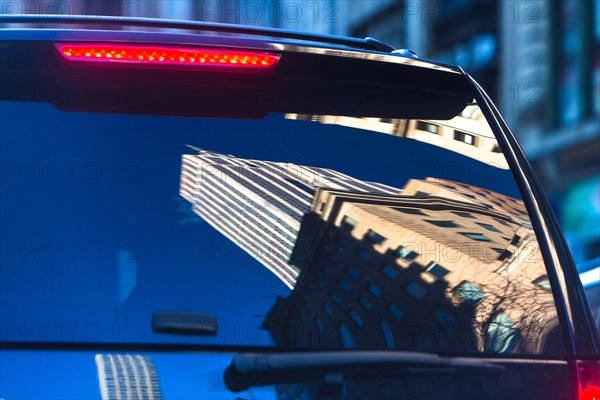 USA, New York State, New York City, Buildings reflecting in windows of suv