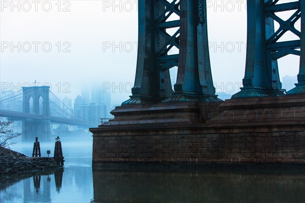 USA, New York, New York City, Manhattan, Brooklyn Bridge over East River in fog