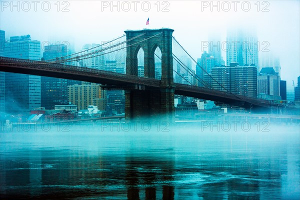 USA, New York, New York City, Manhattan, Brooklyn Bridge over East River in fog