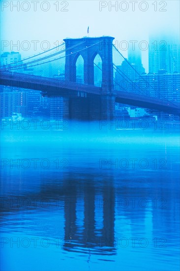 USA, New York, New York City, Manhattan, Brooklyn Bridge over East River in fog