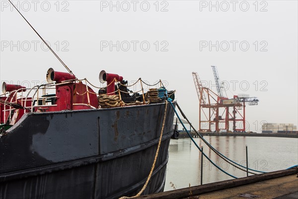 Ship moored in commercial dock