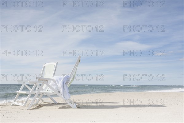 Chairs on beach after sunrise