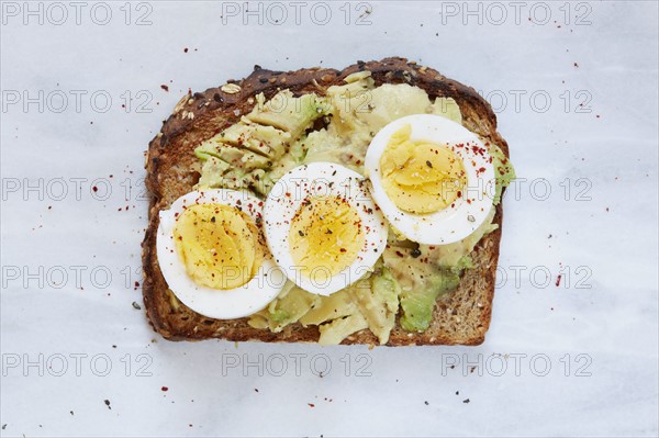 Toasted bread with avocado and hard boiled egg