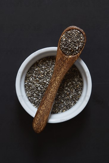 Studio shot of chia seeds in ramekin