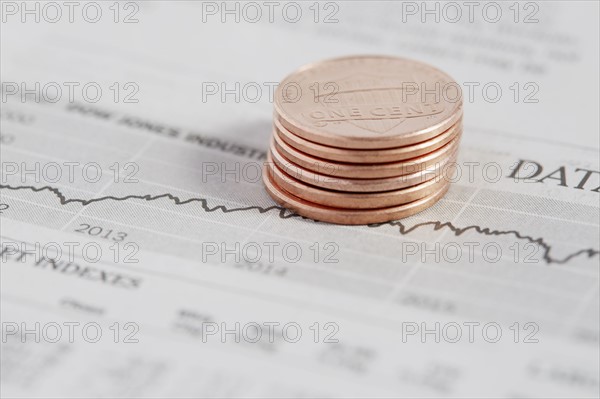 Stack of coins on stock market data