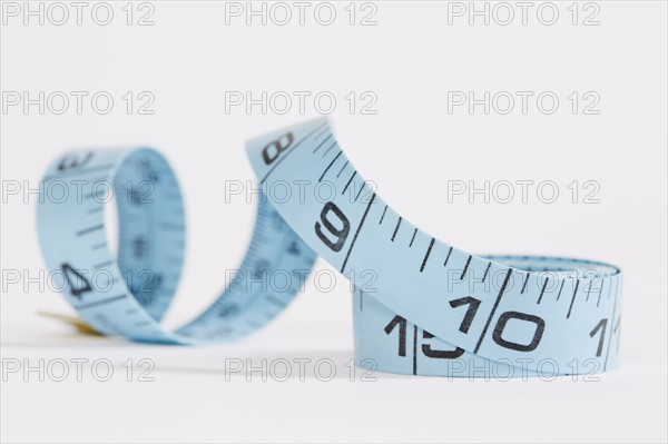 Blue measuring tape on white background