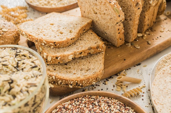 Sliced brown bread on cutting board