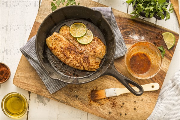 Tilapia on frying pan