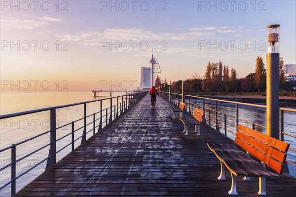 Bridge in city at dawn