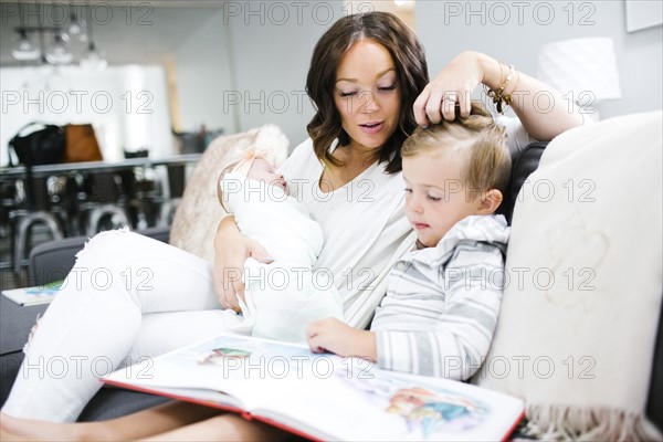 Woman spending time with children (0-1 months, 4-5)