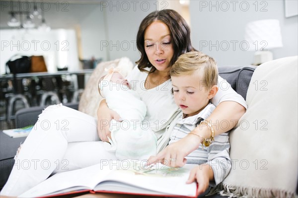 Woman spending time with children (0-1 months, 4-5)