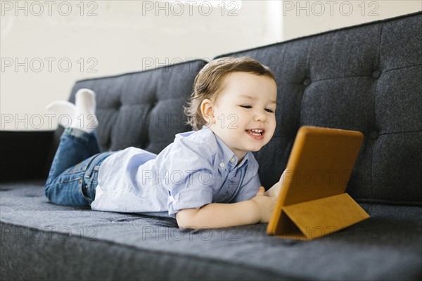 Young boy (4-5) using tablet