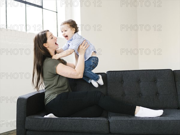 Mother playing with son (4-5)