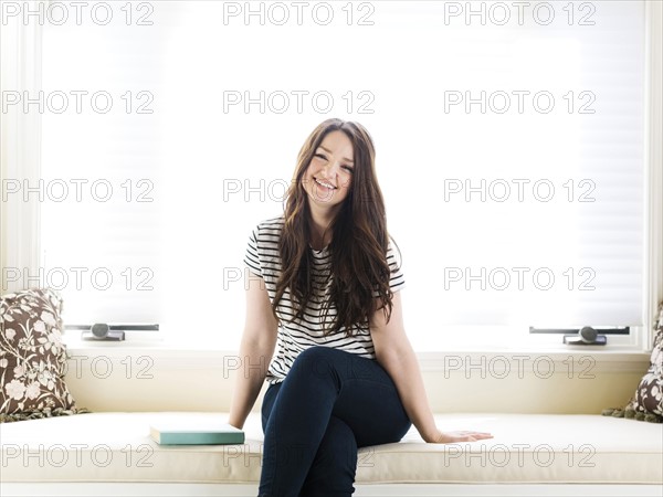 Woman sitting on couch