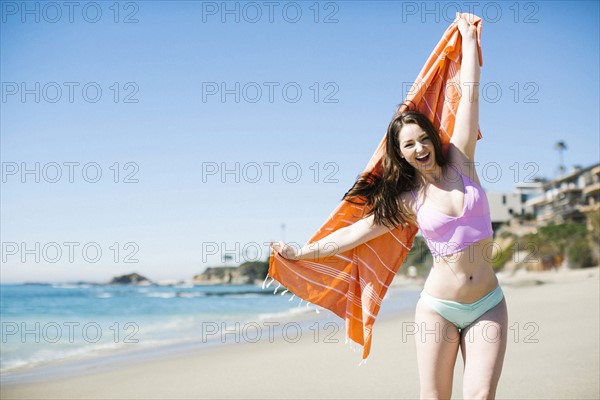 USA, California, Woman laughing on Laguna Beach