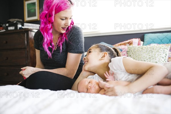 Mother spending time with children (10-11, 2-5 months)